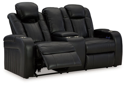Caveman Den - Power Reclining Loveseat with Console/ Adj Hdrst - Midnight